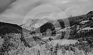 Alps mountains in clouds, black and white