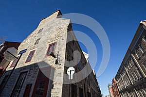 Typical stone housing building from the narrow streets of Old Montreal, Quebec, Canada. photo
