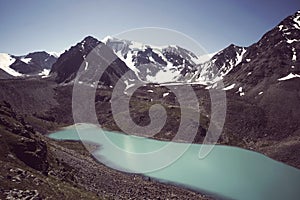 Altai forest reflect on the lake. beautiful landscape in morning time with warm tone. Beautiful calm landscape in the mountains