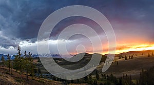 Altai, Ukok plateau. Beautiful sunset with mountains in the background. Snowy peaks autumn. Journey through Russia, Altay