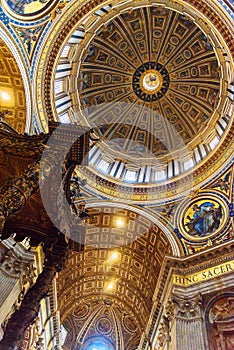 Altar with Bernini`s baldacchino. Interior of Saint Peter`s Basilica in Vatican