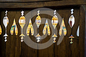 The altar of a Christian Orthodox church seen through decorative holes in the wooden balcony. Beautiful old church in Dryanovo, Bu