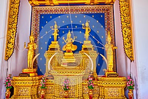 The Altar of City Pillar Shrine with gilden figures and floral patterns, Bangkok, Thailand