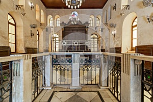 Altar of historic Jewish Maimonides Synagogue or Rav Moshe Synagogue with wooden entrance at the far end, Cairo, Egypt photo