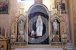Altar of Our Lady of Lourdes in the church of Saint Matthew in Stitar, Croatia photo