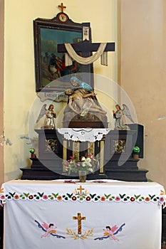 Altar of Our Lady of Sorrows in the Church of the Assumption of the Virgin Mary in Kupinec, Croatia photo