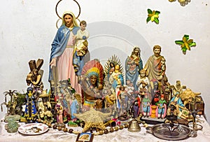 Altar with several images of saints, entities from religions of African origin