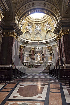 Altar space and a statue of St. Stephen in the interior of St. Stephen`s Basilica. Budapest