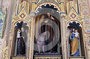 The altar of St. Anthony the Great in the church of Saint Matthew in Stitar, Croatia photo