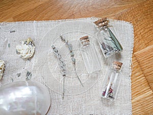 Altar to perform rituals with shells, dried flowers  and jars with lavander