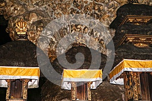 Altars at Pura Goa Lawah or Bat Cave Temple. Balinese Hindu temple in Pesinggahan, Klungkung, Bali, Indonesia. Many bats hanging