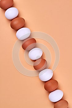 Alternation of white and brown eggs.