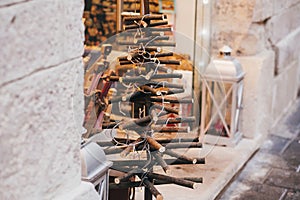 Alternative Christmas tree of wooden planks with lights in european city street. Simple Festive decorations and illumination in w