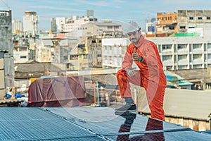 Alternative energy engineer checking energy power performace of solar power system