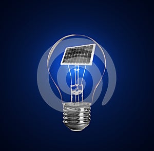 Alternative energy source. Light bulb with solar panel on background