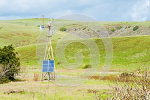 Alternative Energy Sources Solar Panel on Vintage Windmill Juxtaposition