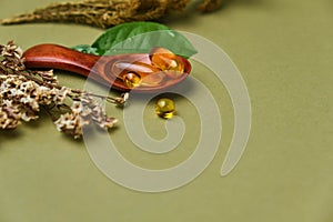 Alternative and herbal medicine, fresh mandarin leaves in wooden spoons