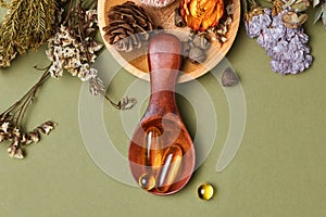 Alternative and herbal medicine, fresh mandarin leaves in wooden spoons