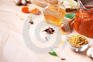 Alternative medicine concept. Ingredients for flu fighting natural hot drink. Copy space. Lemon, ginger, mint, honey, apple and