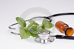 Alternative medicine concept. Stethoscope and herbs