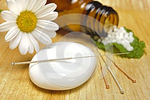 Alternative medicine with herbal pills and acupuncture