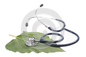 Alternative medicine herbs and stethoscope on leaf