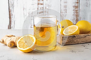 Alternative medicine, natural home remedy for cold and flu. Hot herbal tea with ginger and lemon