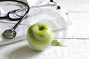 Alternative medicine stethoscope and green symbol background