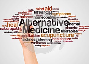 Alternative Medicine word cloud and hand with marker concept