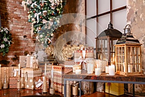 Alternative tree upside down on the ceiling. Winter home decor. Christmas in loft interior against brick wall.