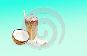 alternative vegan drink Iced coffee in with fresh coconut milk in tall glass isolated on light blue sea gradient background.