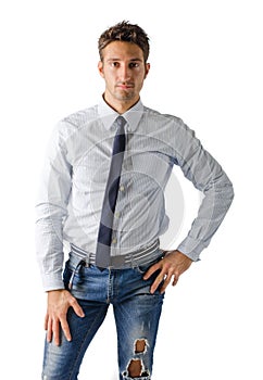 Alternative young business man wearing shirt, tie and ripped jeans