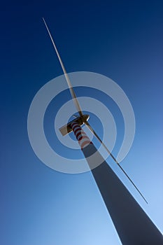 Wind turbine in the blue sky photo