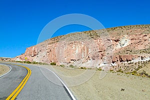 Altiplano desert arid landscape and asphalt road