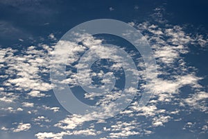 Altocumuls clouds in a blue sky photo