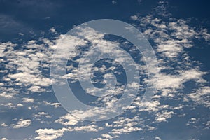 Altocumuls clouds in a blue sky photo