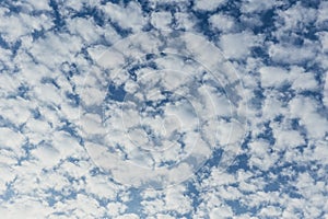 Altocumulus patch layered fluffy clouds