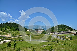 Landscape with biathlon base at the Fundata Resort at Cheile Gradistei with Piatra Craiului Mountains in the background. photo
