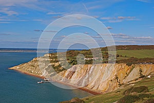 Alum Bay with her popular coloured sand with pier and chairlift station