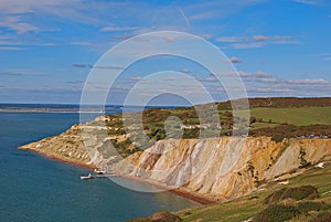 Alum Bay with her popular coloured sand with pier and chairlift station photo