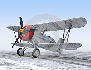 Aluminium biplane standing on ground