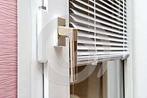 Aluminium blinds on PVC window