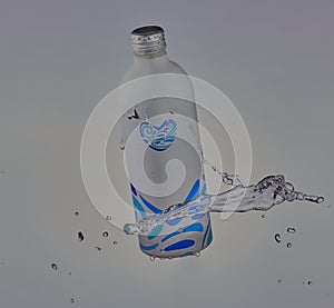 Aluminium bottle of spring water on white background.