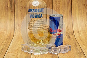 Aluminium can of Red Bull Energy drink with ice and drops, Vodka Absolut. Red Bull is the most popular energy drink in the world.