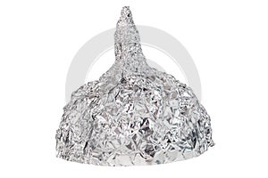 Aluminium foil hat isolated on white background, symbol for conspiracy theory and mind control protection. photo