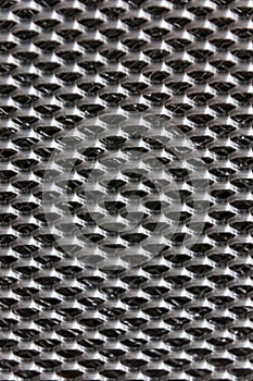 Aluminium mesh pattern on black background