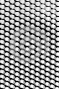 Aluminium mesh pattern on black background