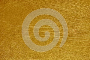 Aluminium metal texture background with gold color, scratches on polished stainless steel