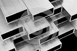 Aluminium profile for windows and doors manufacturing. Structural metal aluminium shapes. Aluminium profiles texture. Aluminium co