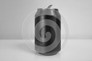 Aluminum Black Soda Can over White Background photo
